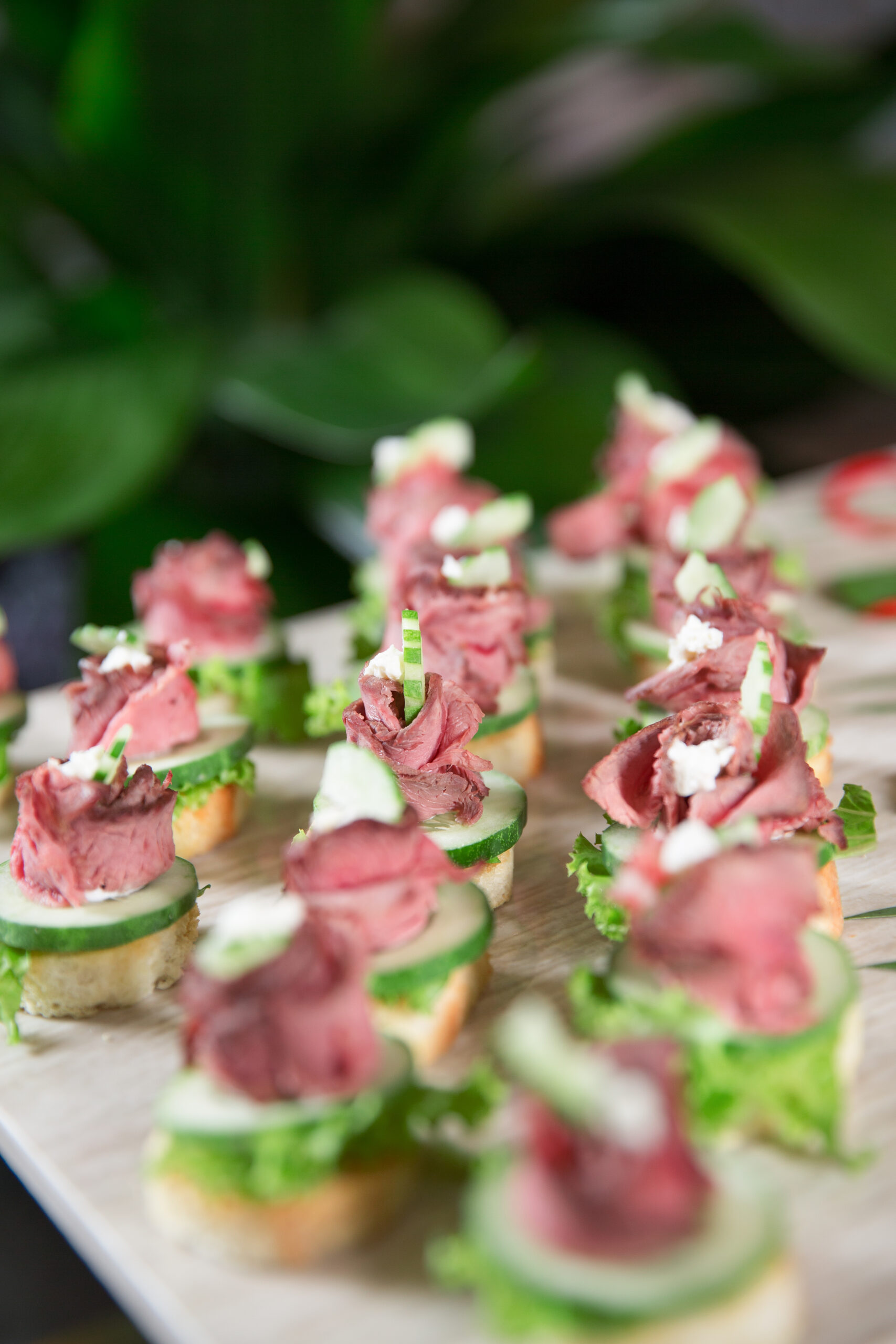 Delicious Mini Canapes with Meat on Buffet Table